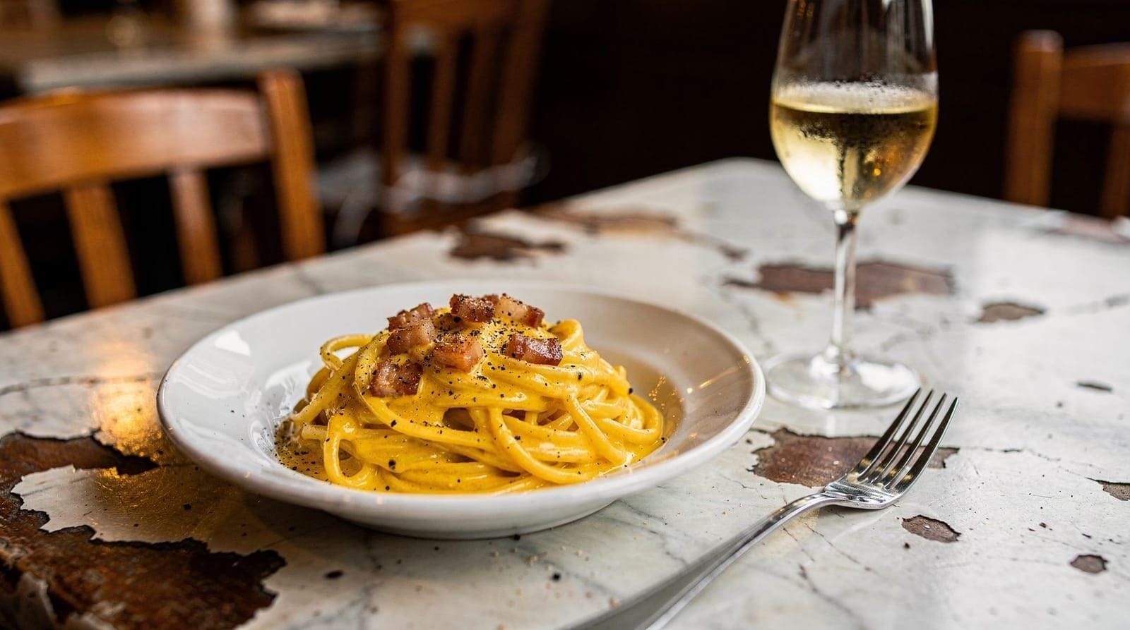 The five Roman pastas: carbonara, cacio e pepe, amatriciana, gricia, and the alfredo myth